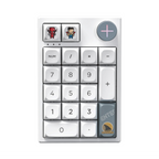 Oyuncu Baykuş Darmoshark K3 Pro beyaz mekanik RGB gaming keypad, özel karakter tuşları ve ses kontrol tekerleği ile.