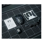 Oyuncu Baykuş Furycube F1 kablosuz gaming mouse, yedek batarya, kullanım kılavuzu ve grip bantları ile kutu içeriği